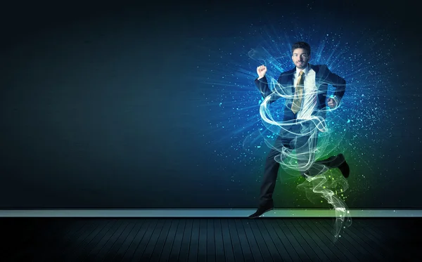 Talented cheerful businessman jumping with glowing energy lines — Stock Photo, Image