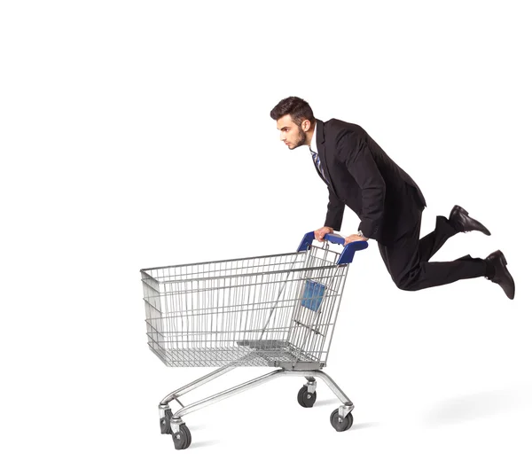 Businessman with shopping cart — Stock Photo, Image