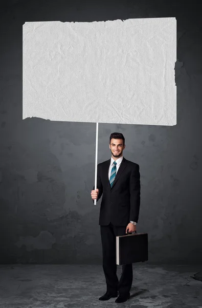 Businessman with blank booklet paper — Stock Photo, Image