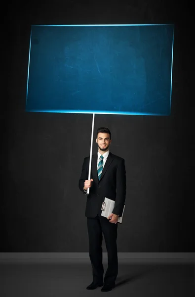 Empresário com placa azul — Fotografia de Stock