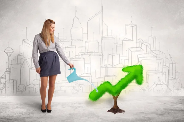 Business woman watering green plant arrow — Stock Photo, Image