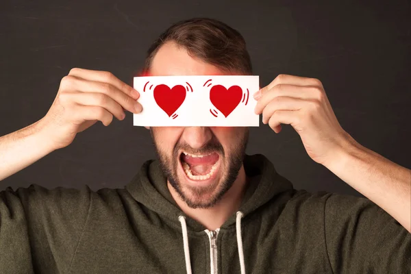 Corte homem segurando papel com leitura coração desenho — Fotografia de Stock