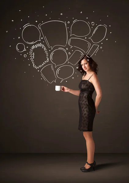 Businesswoman holding a white cup with speech bubbles — Stock Photo, Image