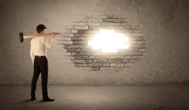 Business man hitting brick wall with hammer and opening a hole clipart