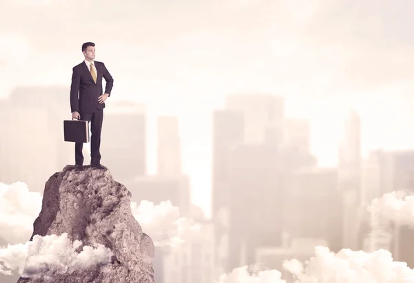 Confident businessman on dangerous cliff — Stock Photo, Image