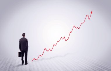 Kırmızı grafik ok ile ayakta işadamı