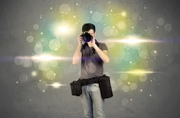 Photographer with flashing lights — Stock Photo, Image