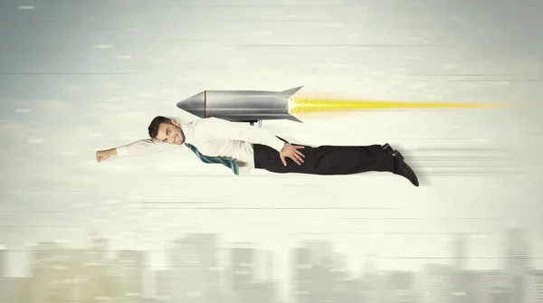 Superhero business man flying with jet pack rocket above the cit — Stock Photo, Image