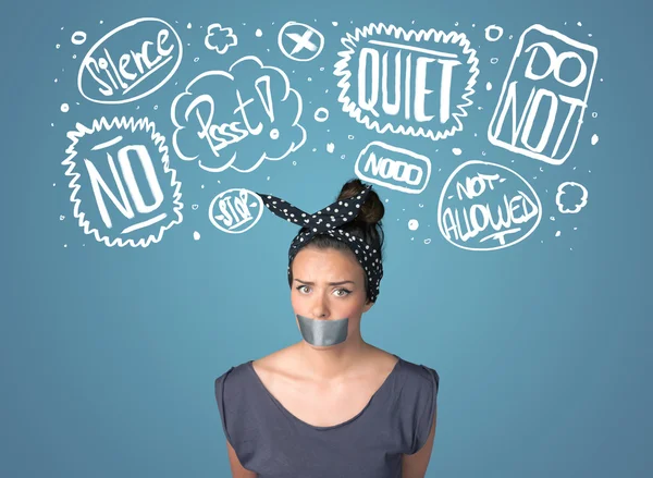 Young woman with glued mouth and thought clouds — Stock Photo, Image