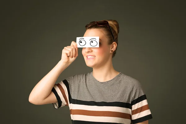 Young silly girl looking with hand drawn eye balls on paper — Stock Photo, Image