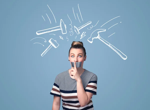 Young woman with glued mouth and hammer marks — Stock Photo, Image