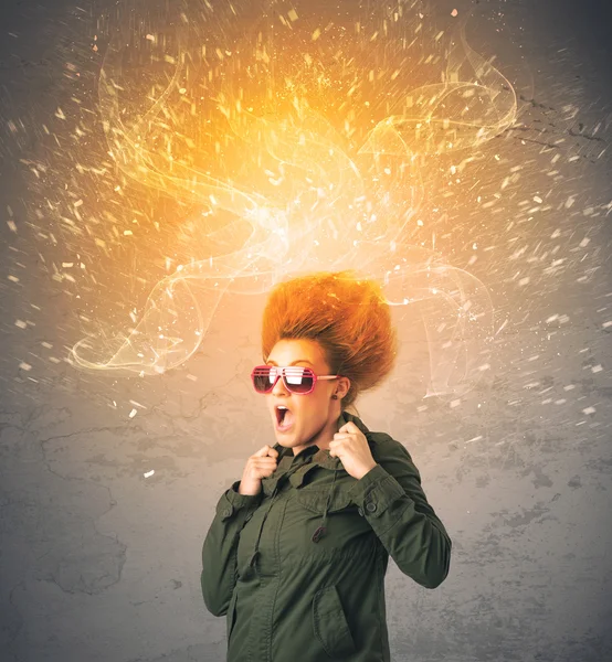 Young woman with energetic exploding red hair — Stock Photo, Image