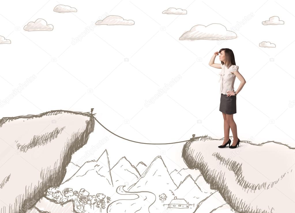 Businesswoman with drawn edge of mountain