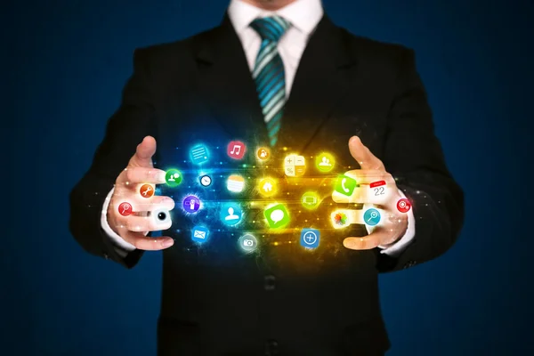 Businessman holding app icon cloud — Stock Photo, Image