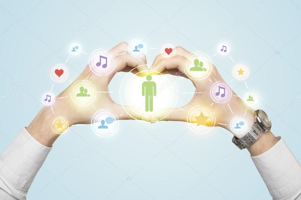 Hands creating a form with social media connection