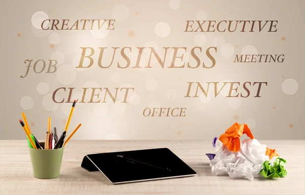 Business office desk with writing on wall — Stock Photo, Image