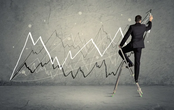 Man on ladder drawing lines — Stock Photo, Image