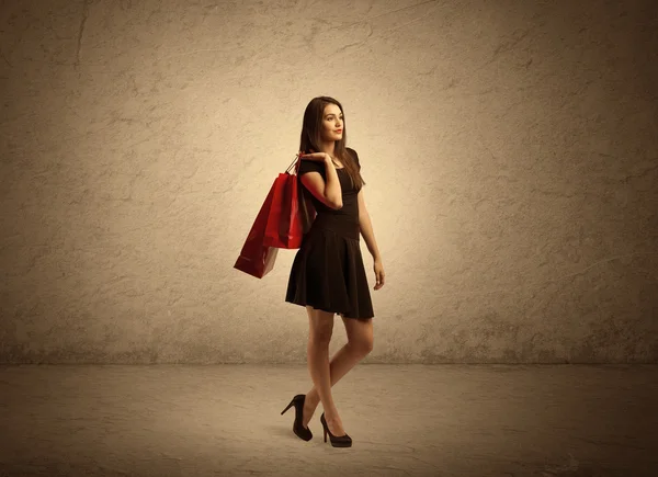 Shopping girl with bags and clear background — Stock Photo, Image