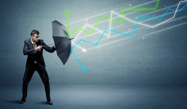 Business person with umbrella and stock market arrows concept — Stock Photo, Image