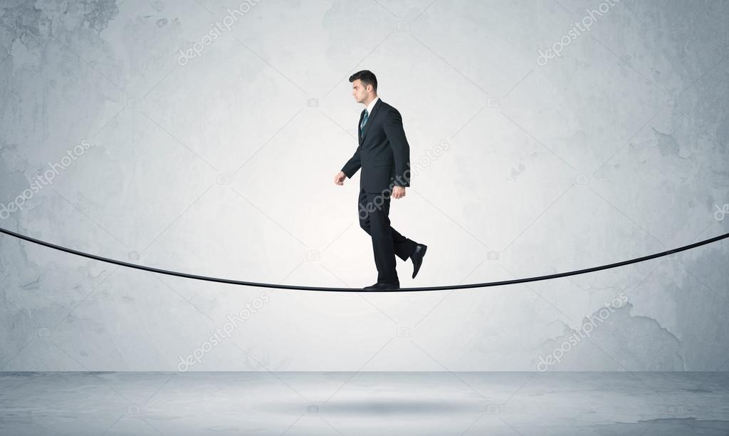 Sales guy balancing on tight rope