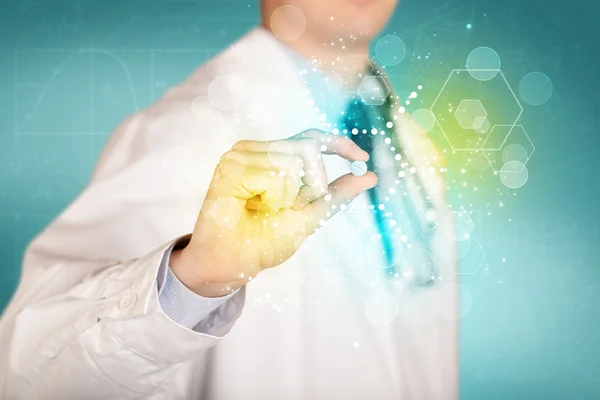 A doctor in tie holding a pill — Stock Photo, Image