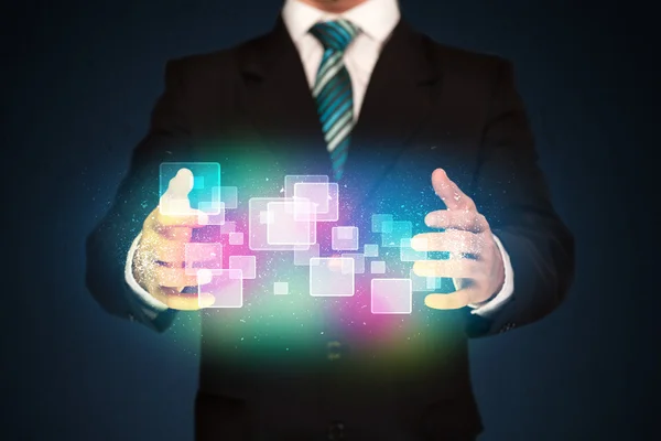 Man holding abstract icons — Stock Photo, Image