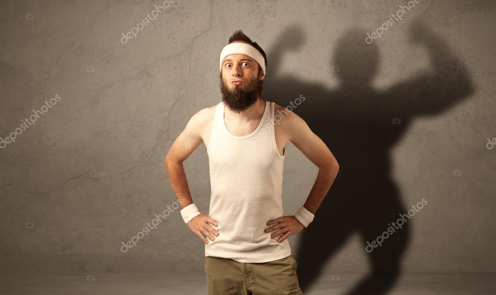 痩せっぽち男とともに筋肉の影 ストック写真 C Ra2studio