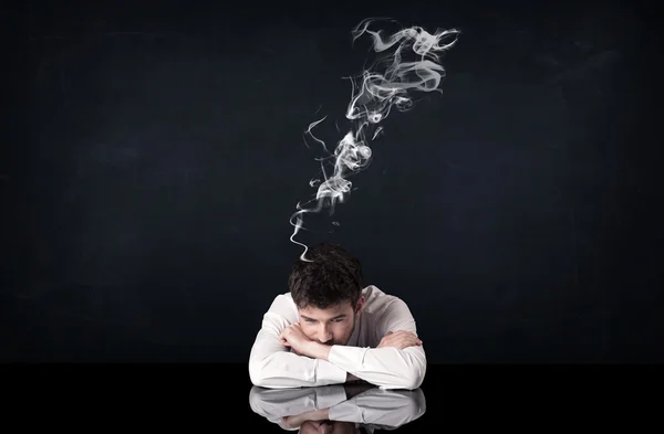 Depressed businessman with smoking head — Stock Photo, Image