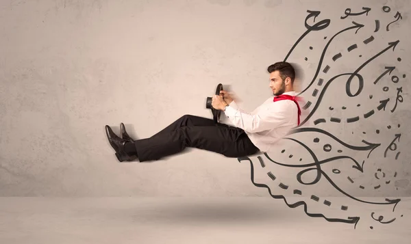 Funny man driving a flying vehicle with hand drawn lines after h — Stock Photo, Image