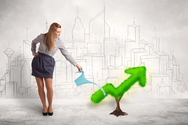 Business woman watering green plant arrow — Stock Photo, Image