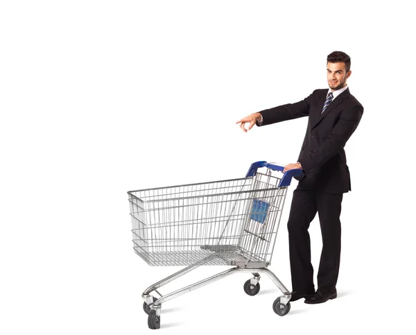 Businessman with shopping cart Stock Picture