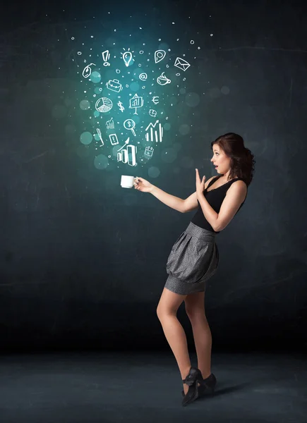 Businesswoman holding a white cup with business icons — Stock Photo, Image