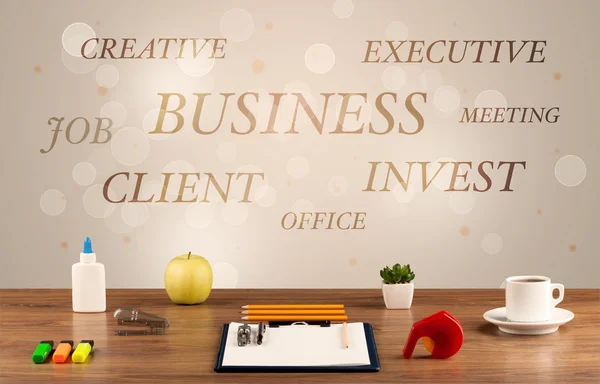 Business office desk with writing on wall — Stock Photo, Image