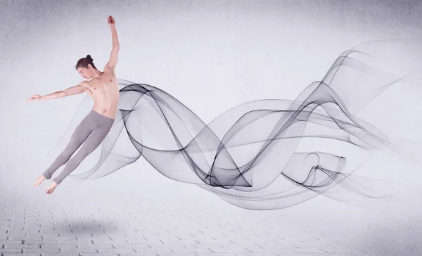 Modern ballet dancer performing with abstract swirl — Stock Photo, Image