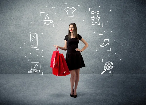 Shopping vrouw met tassen en getekende pictogrammen — Stockfoto