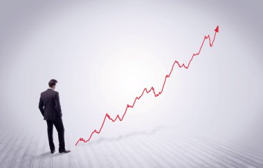 Kırmızı grafik ok ile ayakta işadamı