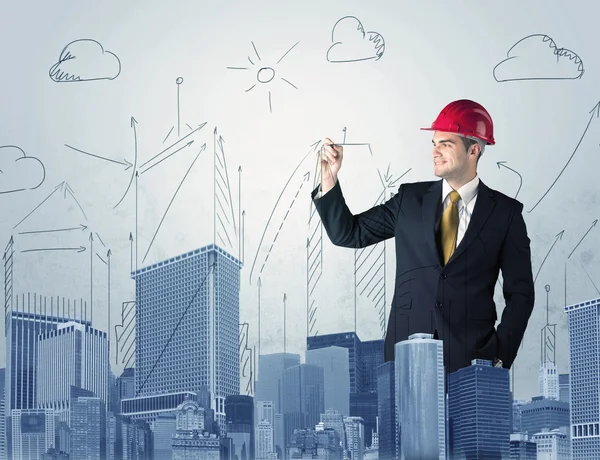 Joven trabajador dibujando una ciudad vista — Foto de Stock