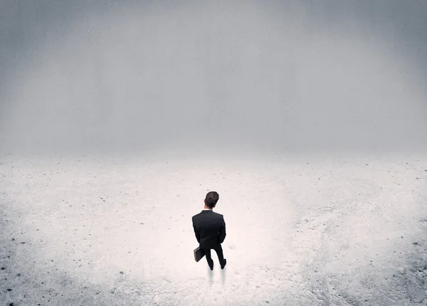 Businessman standing in urban empty space — Stock Photo, Image