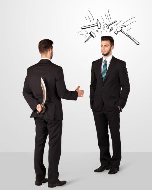 bir silah saklıyor işadamı