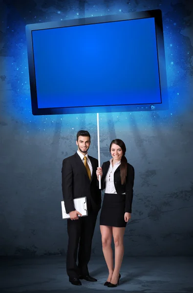 Business couple with shining tablet — Stock Photo, Image