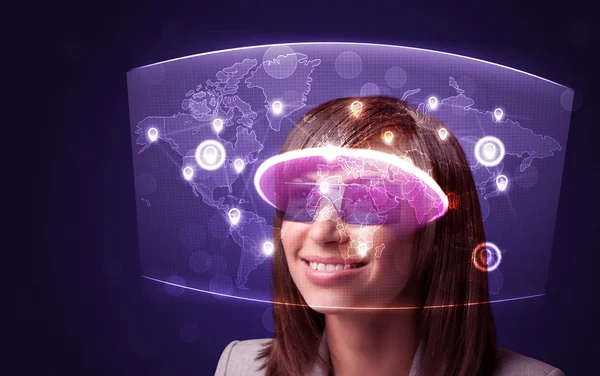 Young woman looking at futuristic social network map — Stock Photo, Image