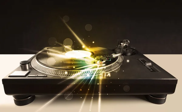 Music player playing vinyl with glow lines comming from the need — Stock Photo, Image