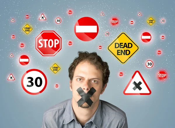 Young man with glued mouth and traffic signals — Stock Photo, Image