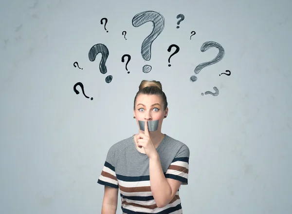 Young woman with glued mouth and question mark symbols — Stock Photo, Image