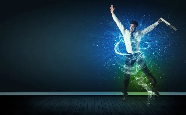 Talented cheerful businessman jumping with glowing energy lines — Stock Photo, Image