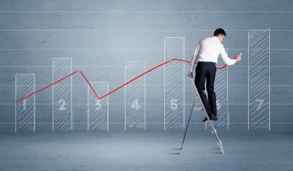 Man drawing chart from ladder — Stock Photo, Image