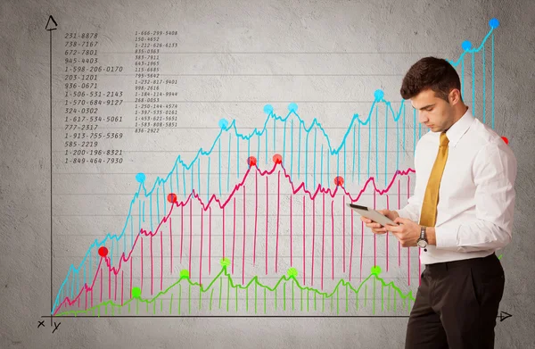 Красочный график с цифрами и бизнесмен — стоковое фото