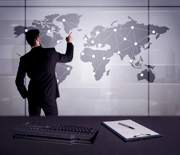 Business person drawing dots on world map — Stock Photo, Image