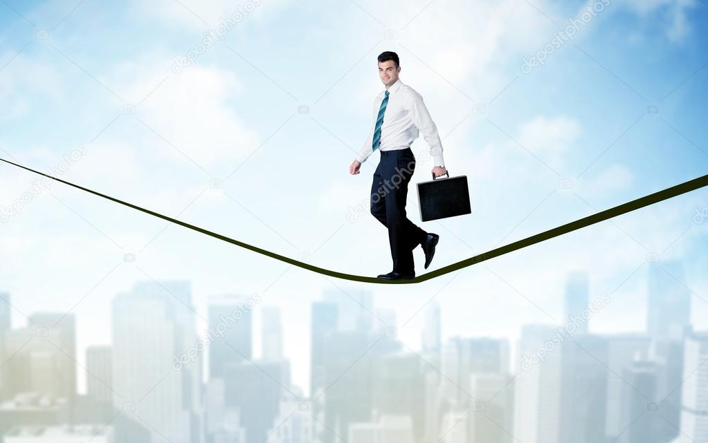 Salesman walking on rope above the city