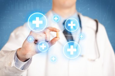 Haçlı bir hap gösteren bir doktor.